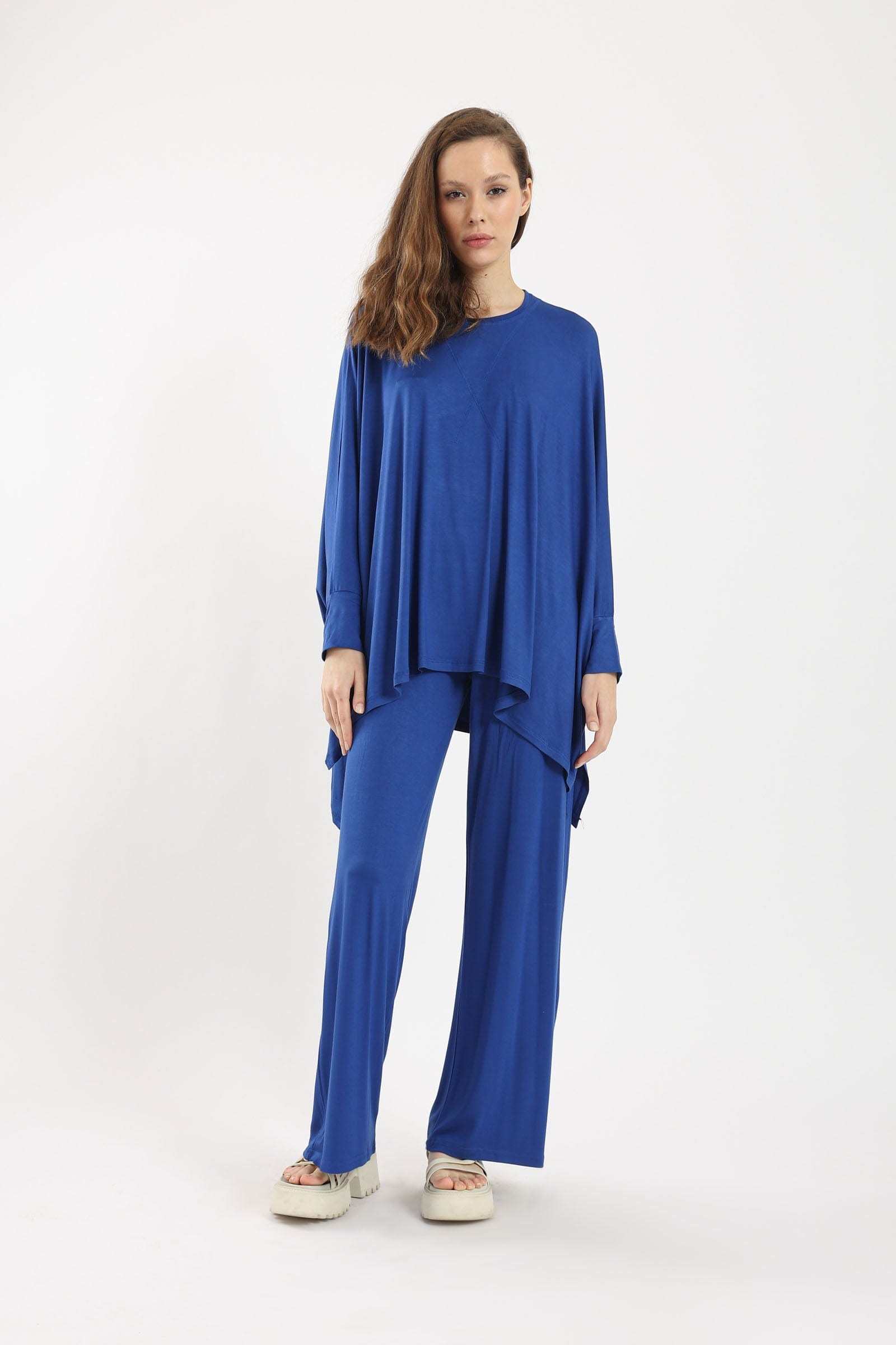 كارينا بلوزة سادة أوفر سايز غير متساوية من أسفل كم طويل