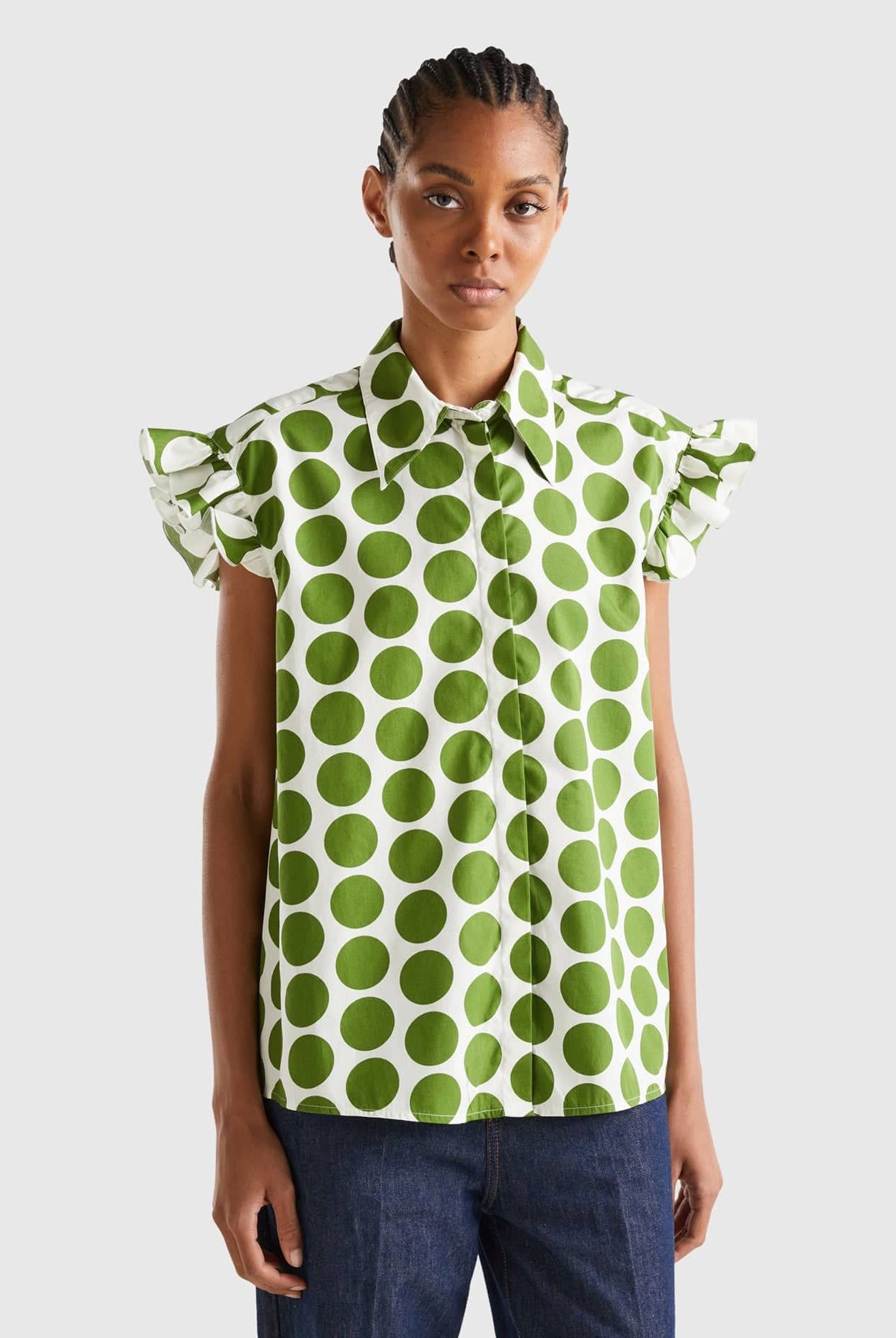 يونايتد كولورز اوف بينيتون قميص نسائي بدون أكمام منقط