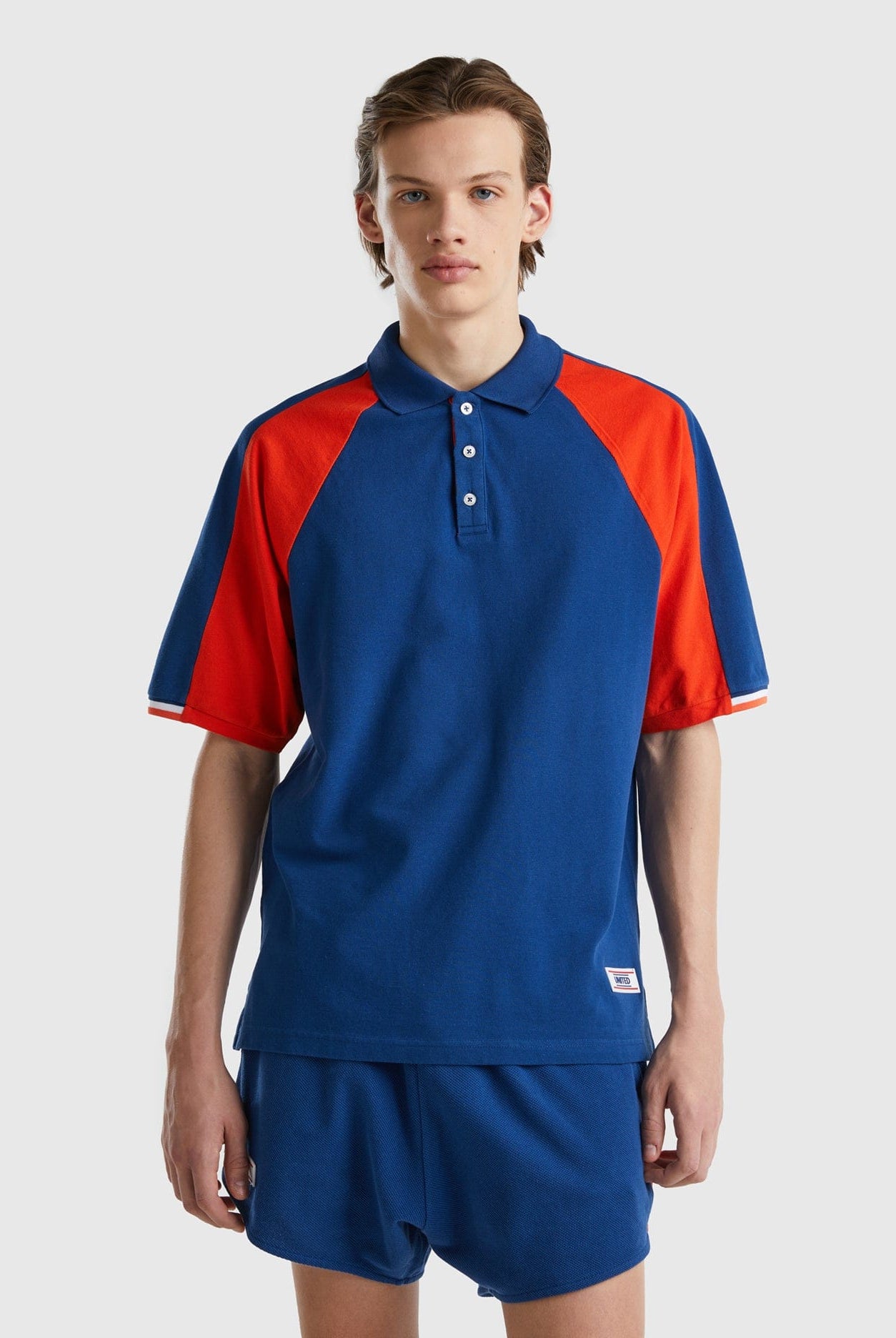 يونايتد كولورز اوف بينيتون تيشيرت بولو شبابي بأشرطة