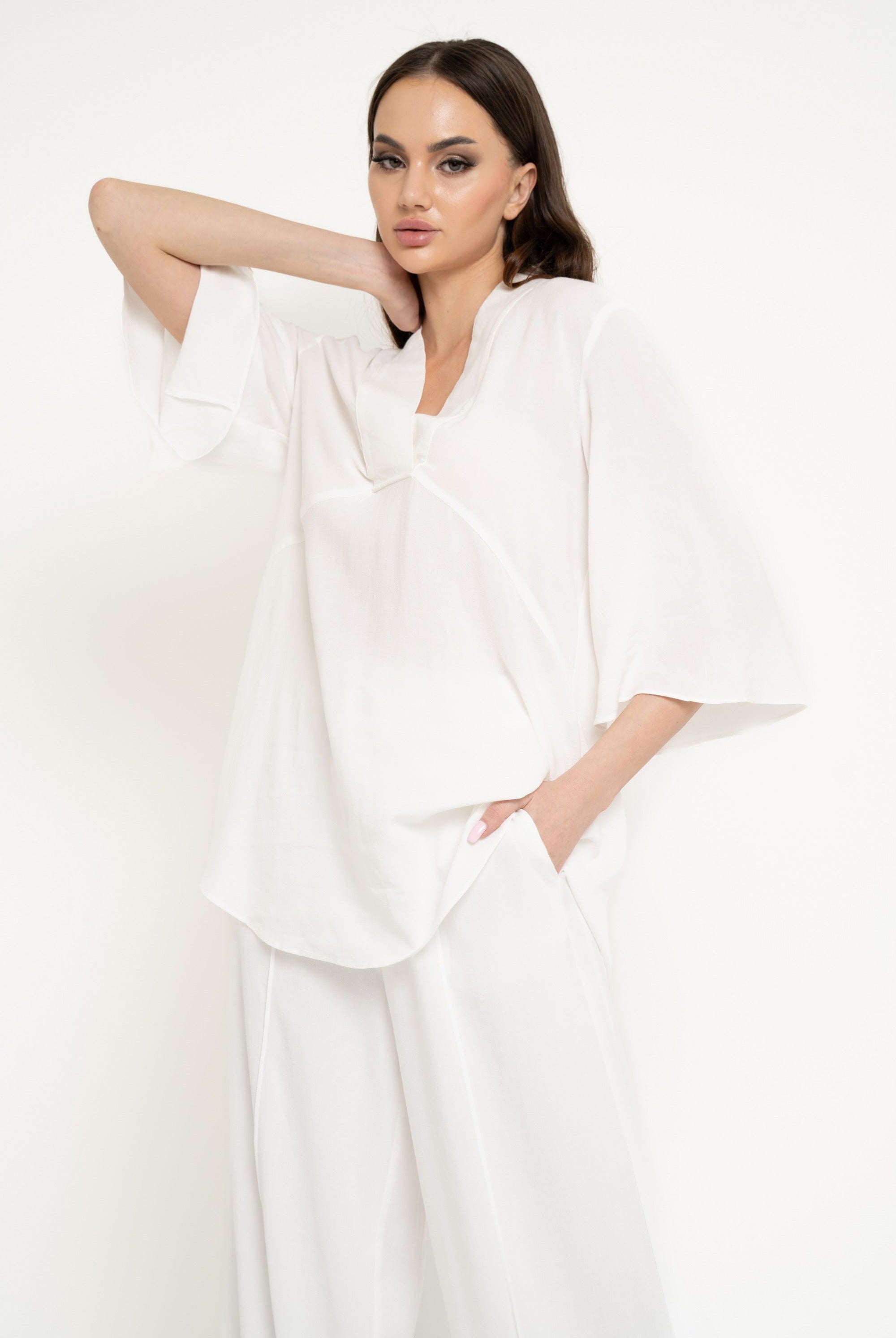 نتشي بلوزة سادة واسعة 3/4 كم نسائي