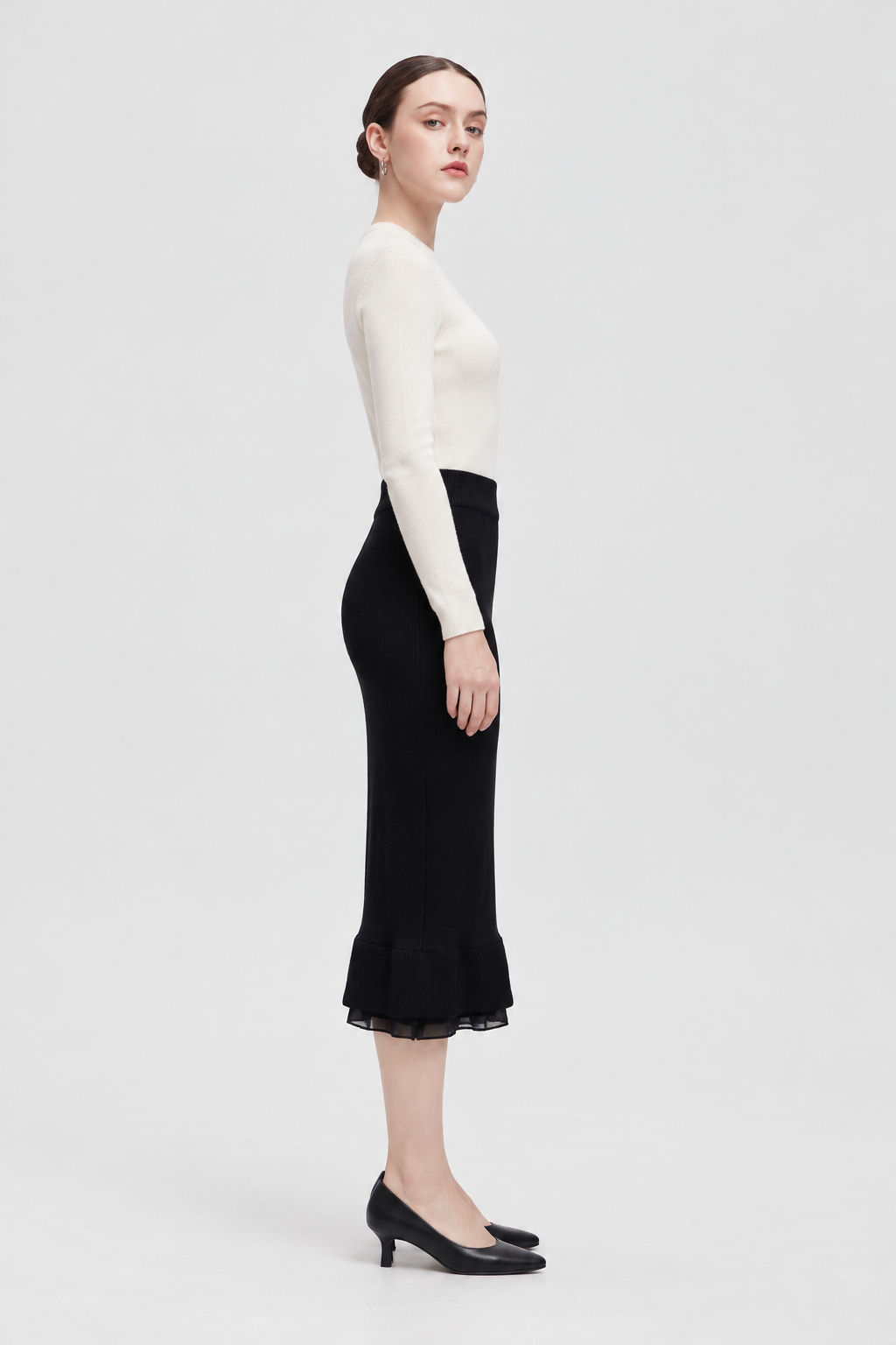 Black midi skirt — side view