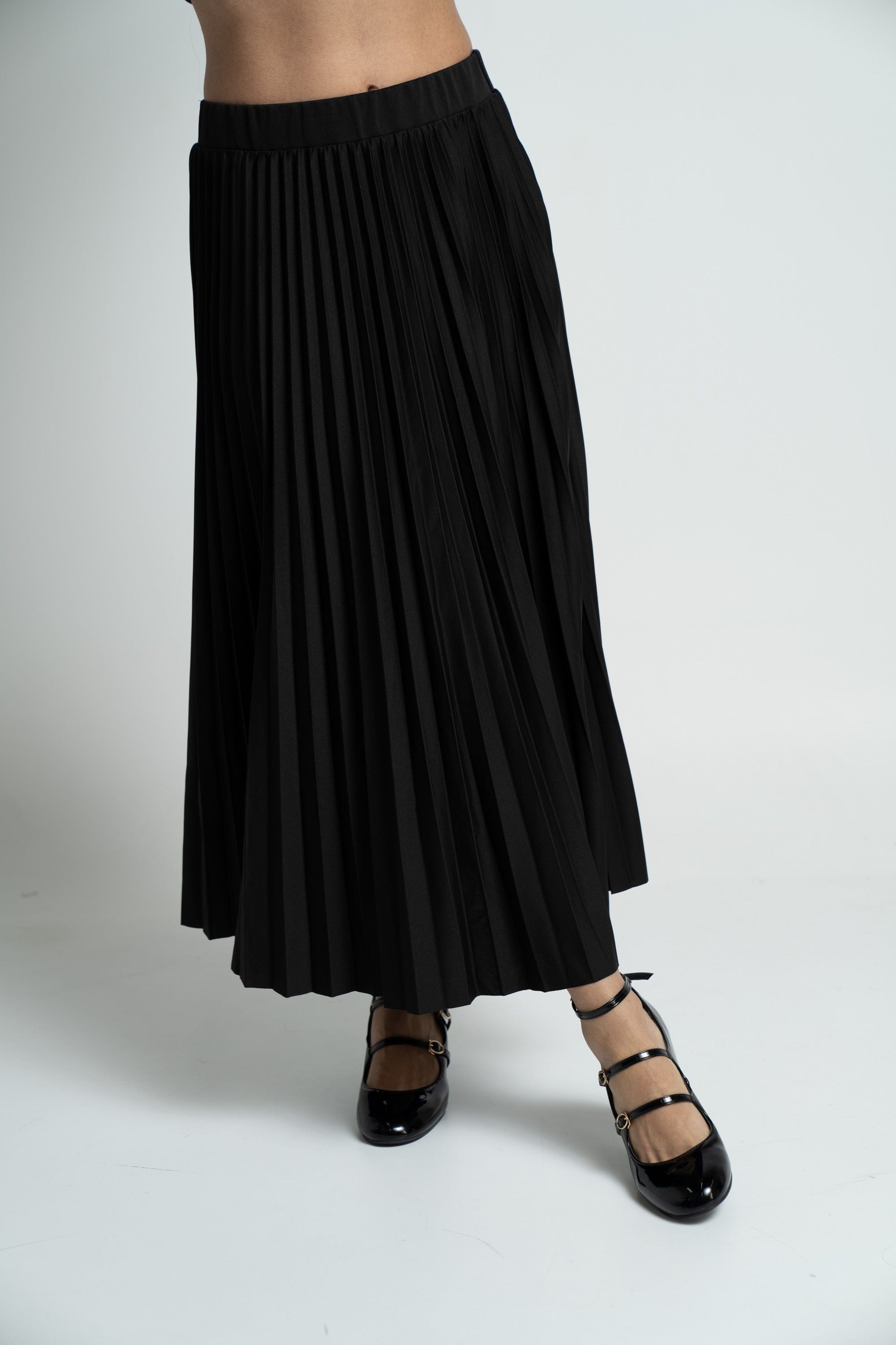 ميكا تنورة ميدي سادة بليسية