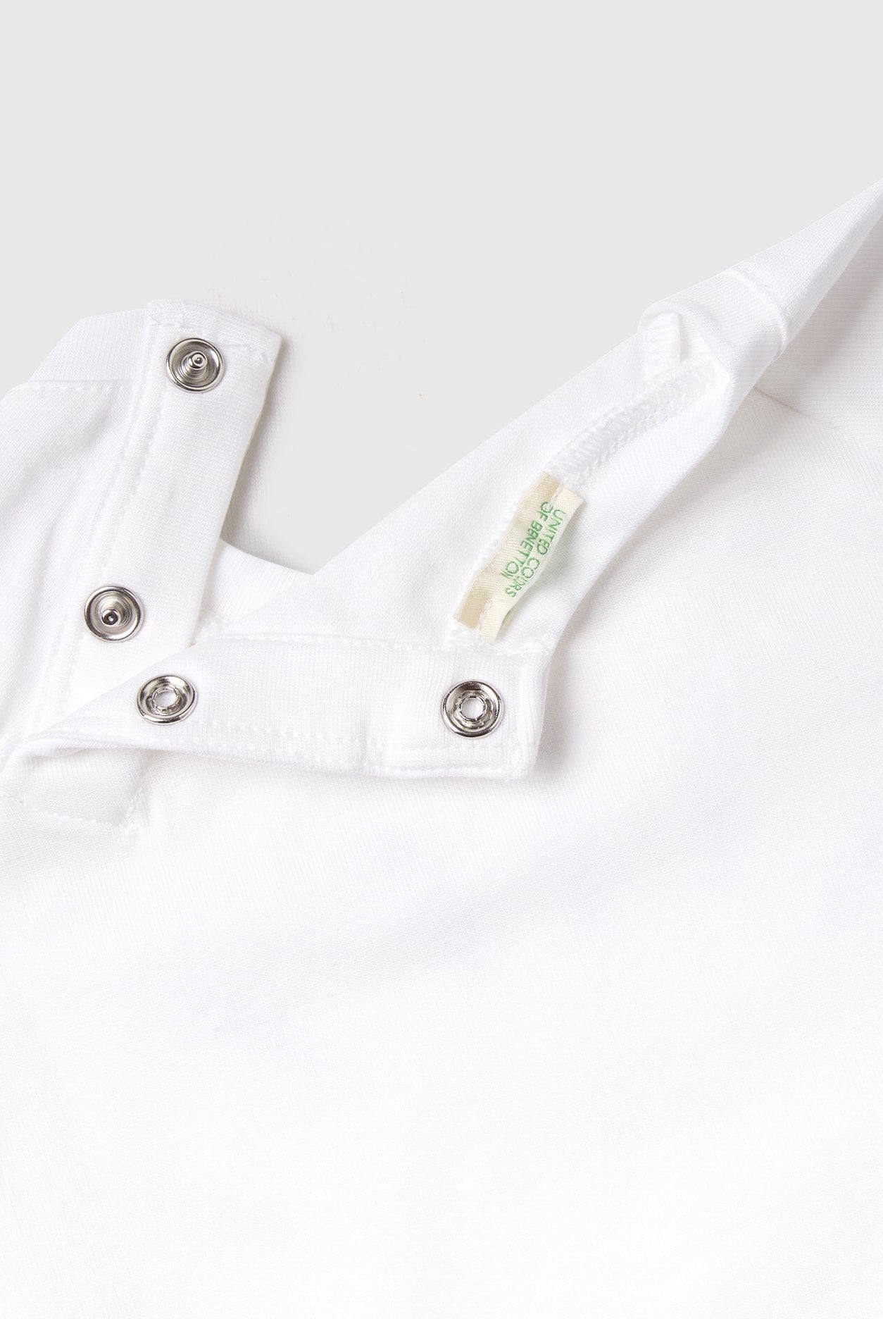 يونايتد كولورز اوف بينيتون بودي سوت أطفال نص كم بطبعة على الصدر