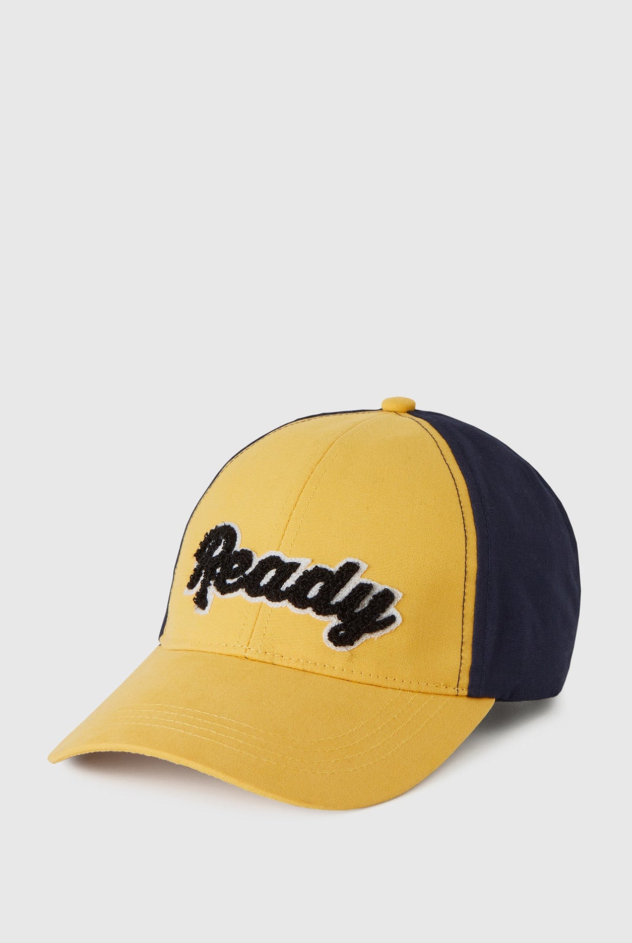 يونايتد كولورز اوف بينيتون قبعة ولادي بلونين مع طباعة