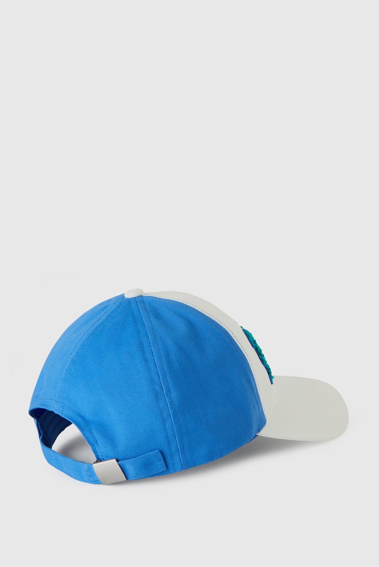 يونايتد كولورز اوف بينيتون قبعة ولادي بلونين مع طباعة