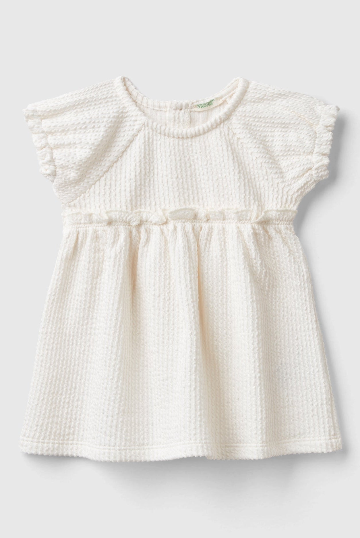 يونايتد كولورز اوف بينيتون طقم من قطعتين بطبعة جرافيك على الجزء العلوي وتفصيلة عقدة على المعصم رضع