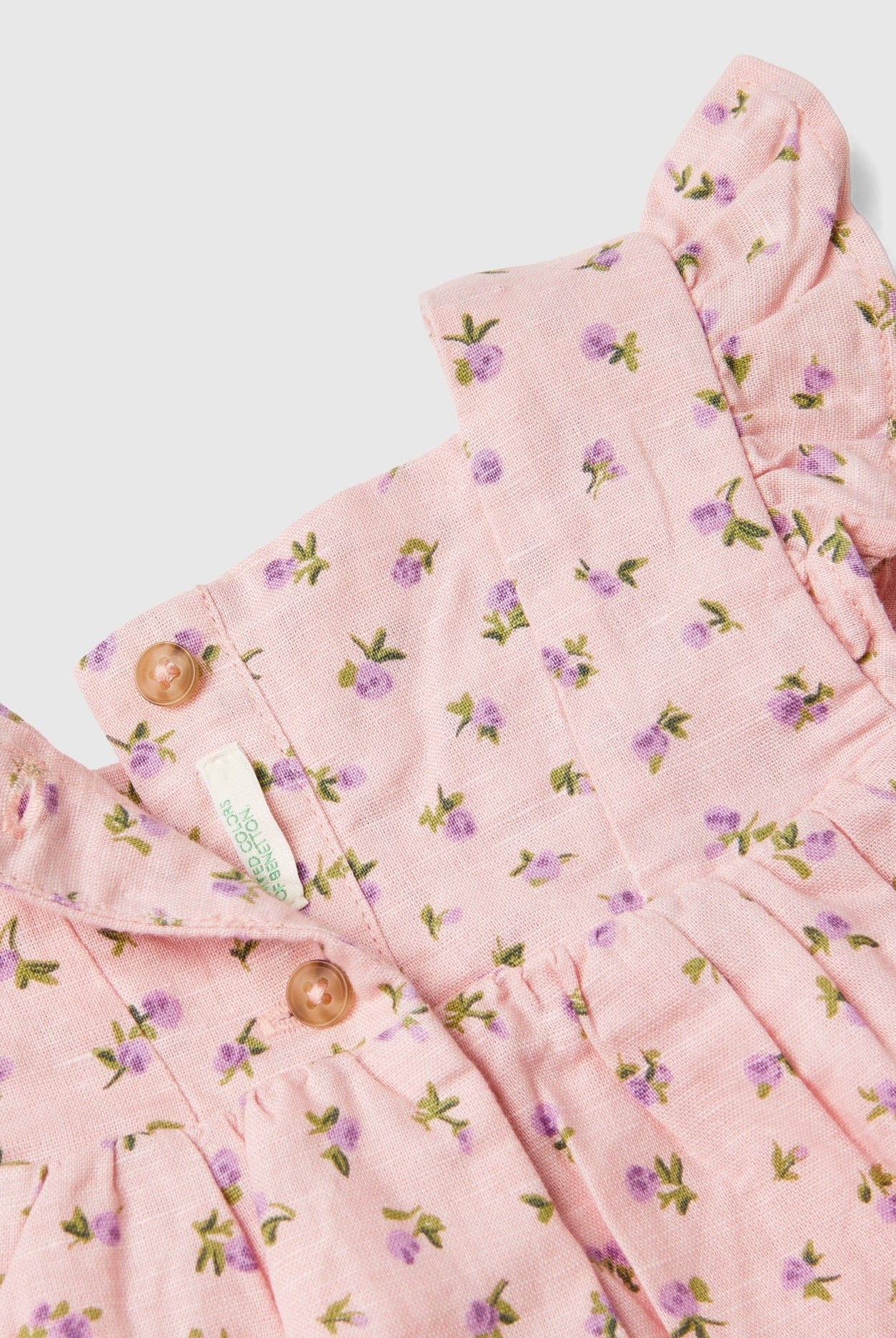 يونايتد كولورز اوف بينيتون فستان بنقوش وأزرار زخرفية وكشكش رضع