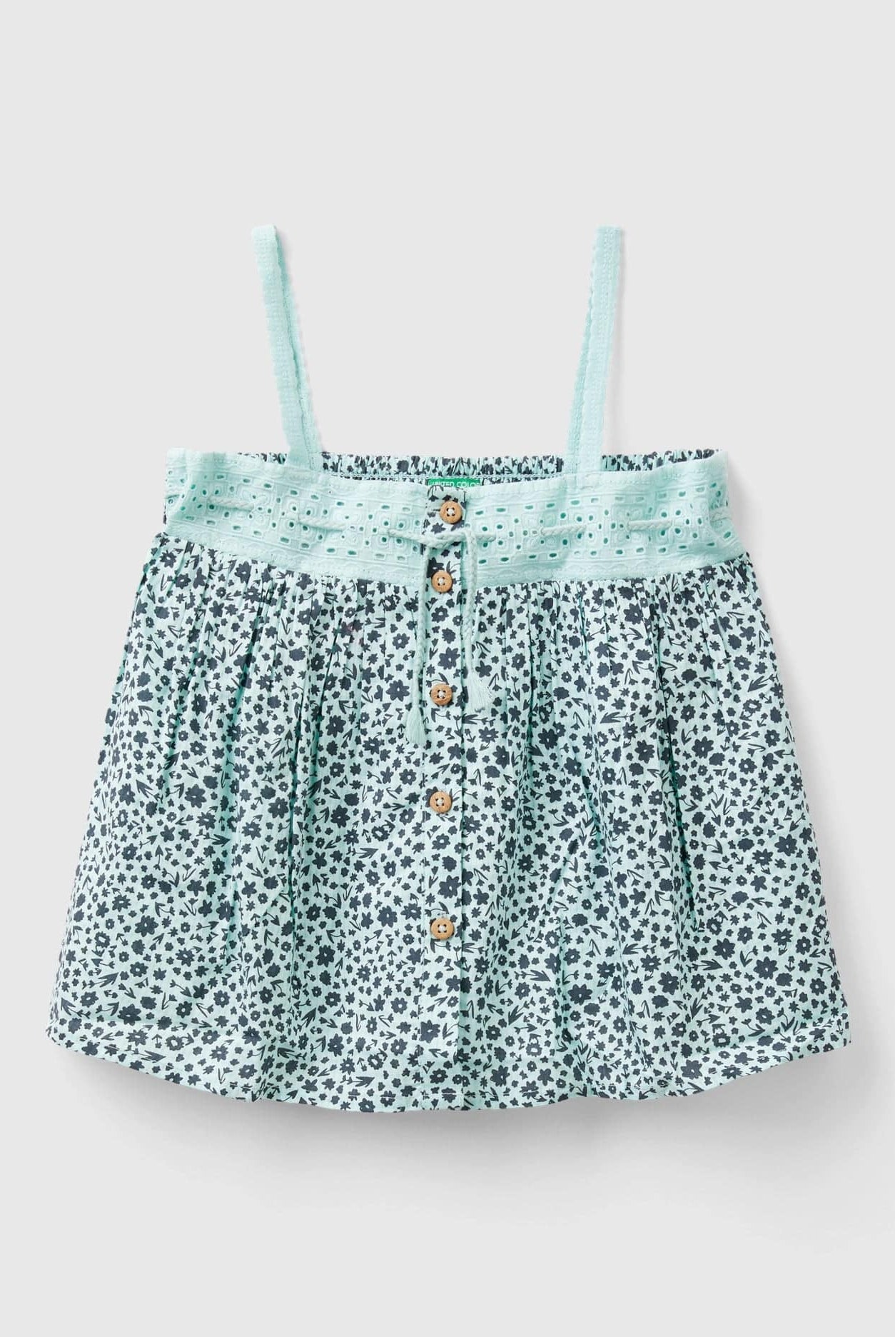 يونايتد كولورز اوف بينيتون بلوزة مطبوعة بأزرار على الجزء الأمامي وحزام مطاطي على الظهر للفتيات