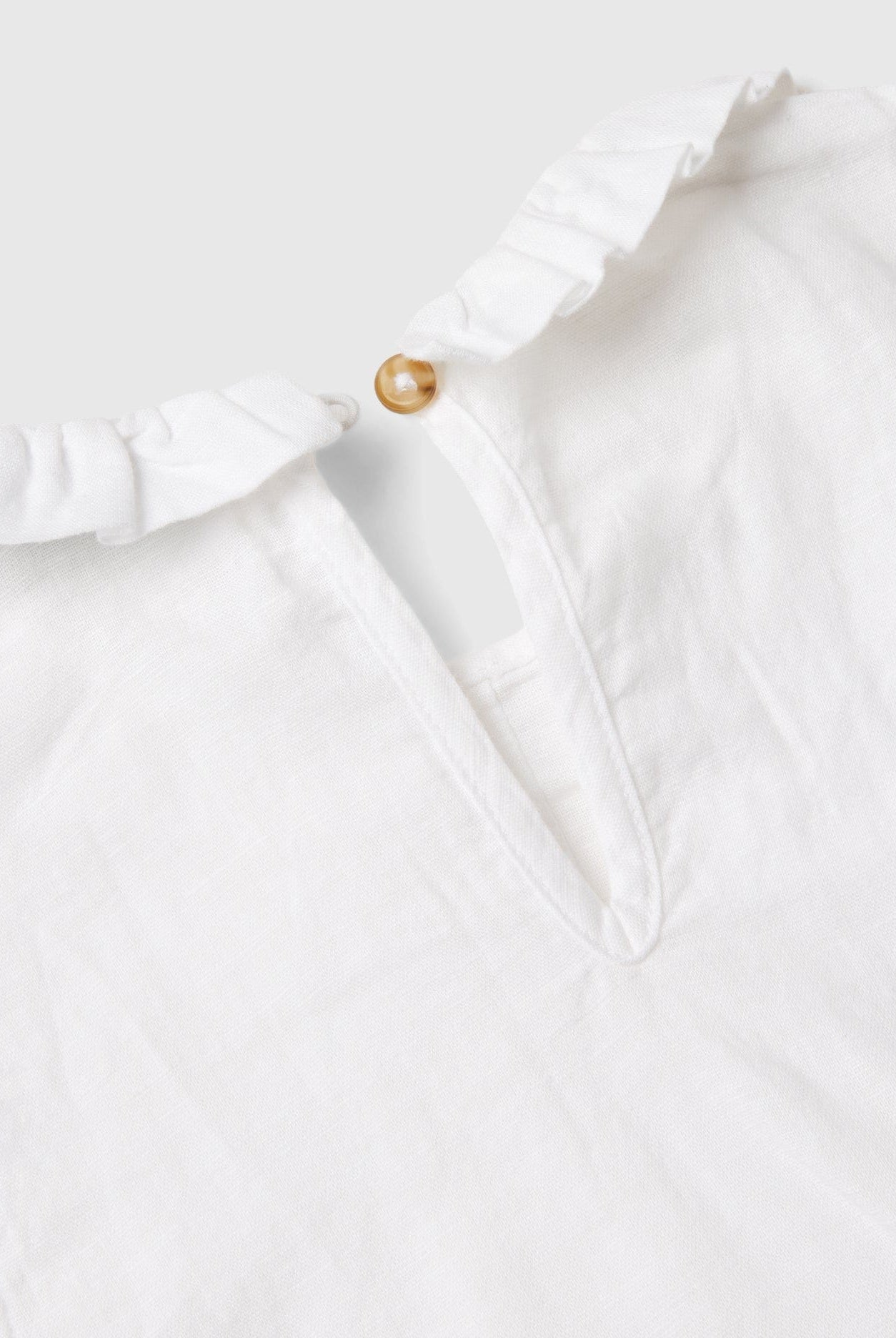 يونايتد كولورز اوف بينيتون بلوزة بناتي بدون أكمام مع ياقة مكشكشة