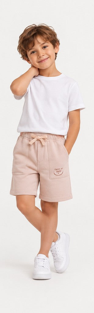 Lifestyle view of Gingersnaps boys blush pink printed shorts