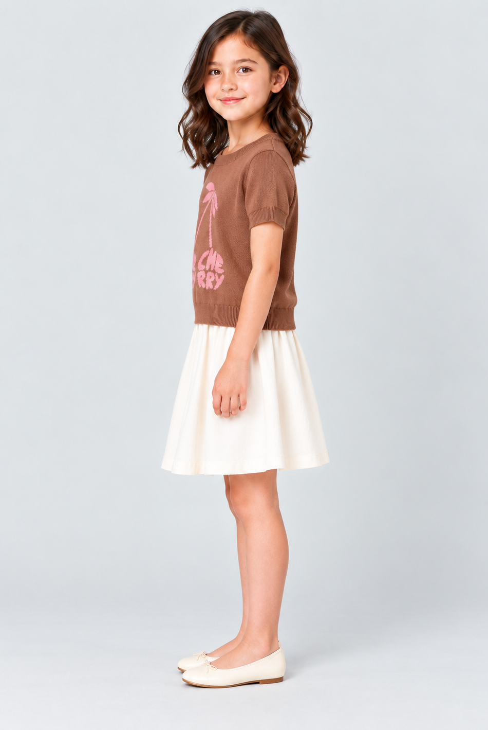 Girls brown knit cherry top, side view
