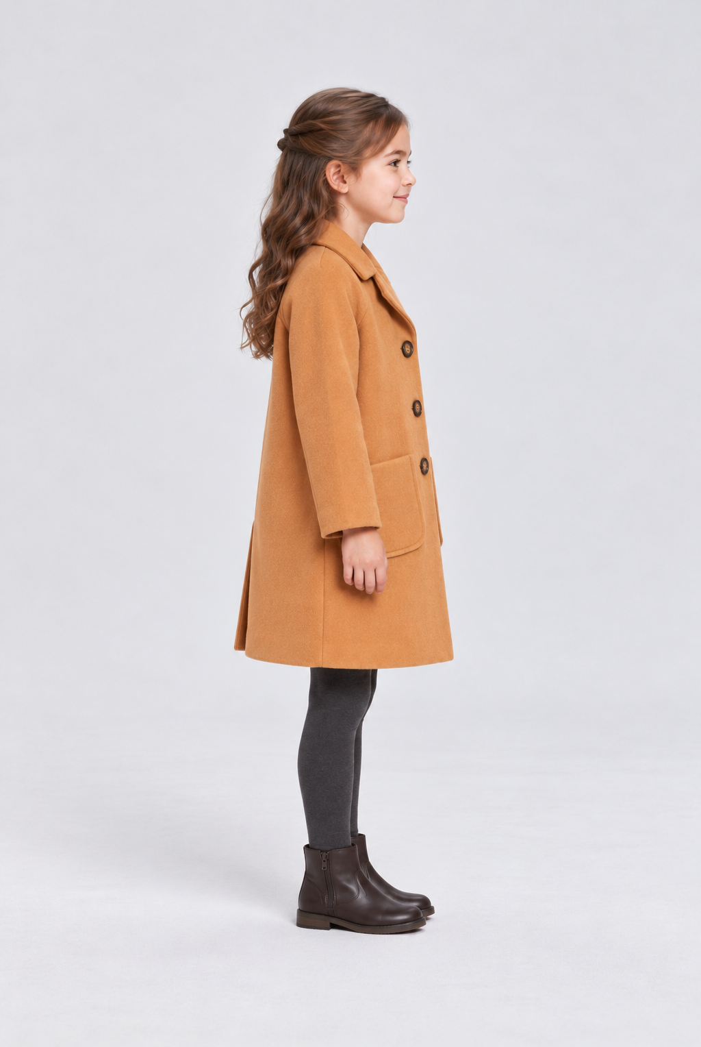 Gingersnaps camel coat on child model, left side view