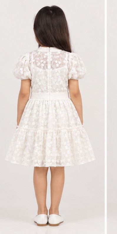 Girl model back view wearing Gingersnaps white embroidered tiered dress