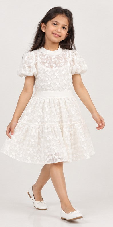 Girl model lifestyle view wearing Gingersnaps white embroidered tiered dress