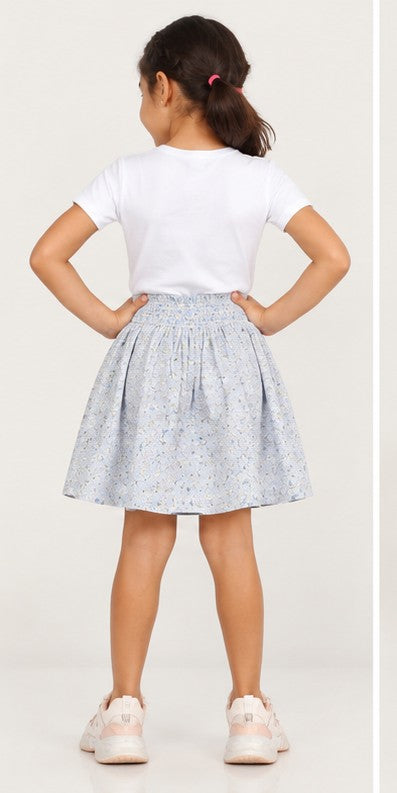 Girls model back view wearing Gingersnaps pale blue floral skirt