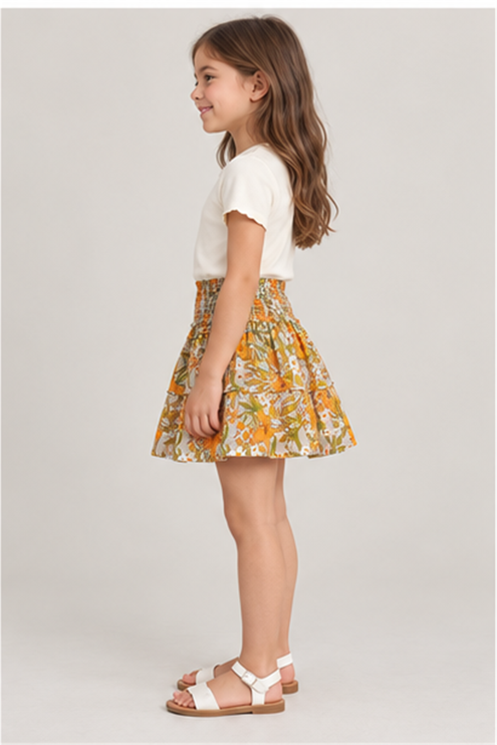 Girls' floral skirt on child model, left side view