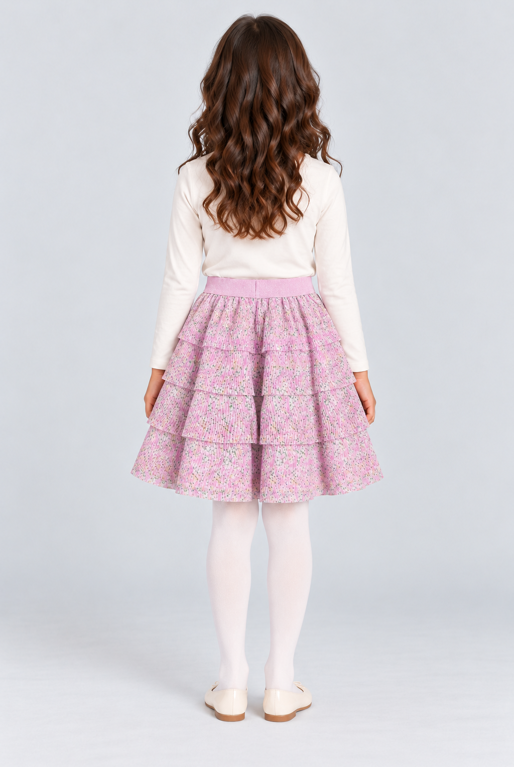Girls multi-tier floral skirt on child model, back view