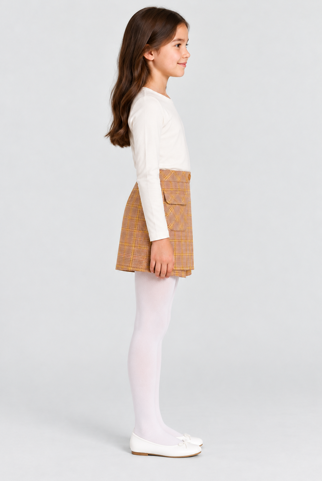 Girls plaid skort on child model, side view