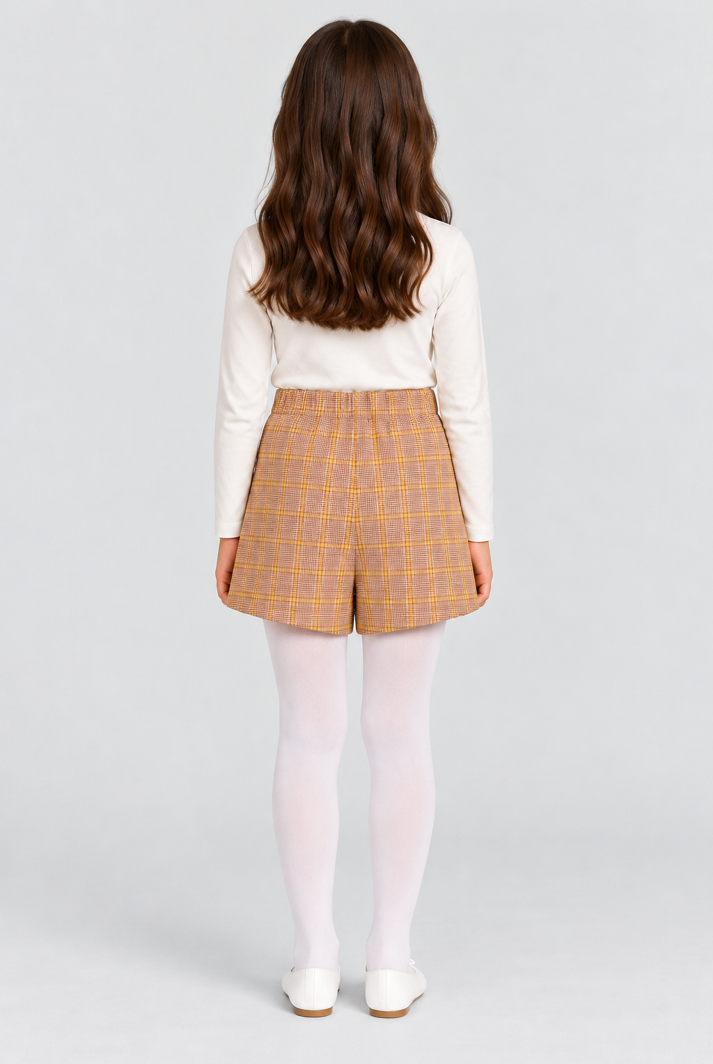 Girls plaid skort on child model, back view