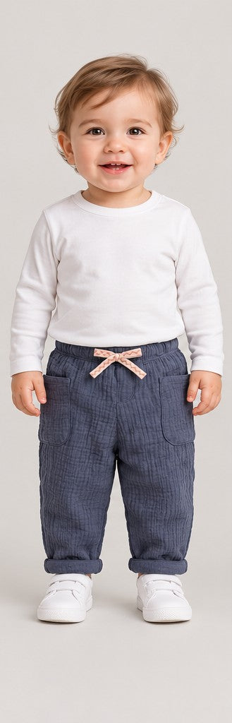 Front view of boys' slate blue quilted baby trousers on a toddler boy