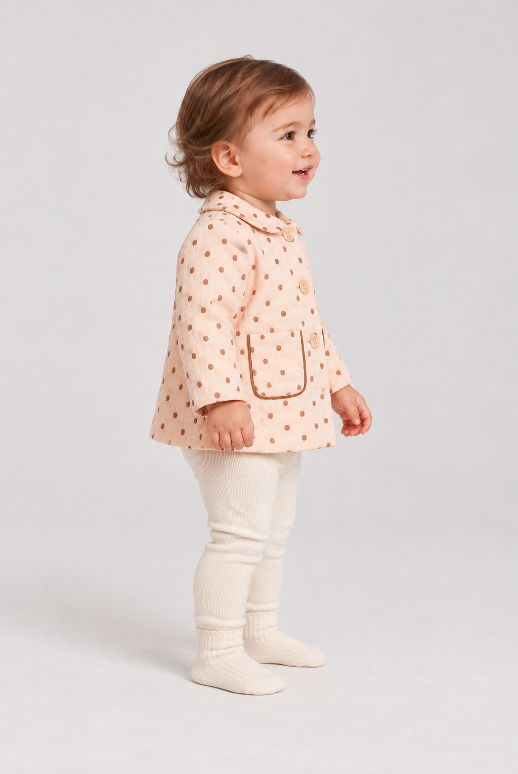 Right side baby girl model view of Gingersnaps dotted jacket