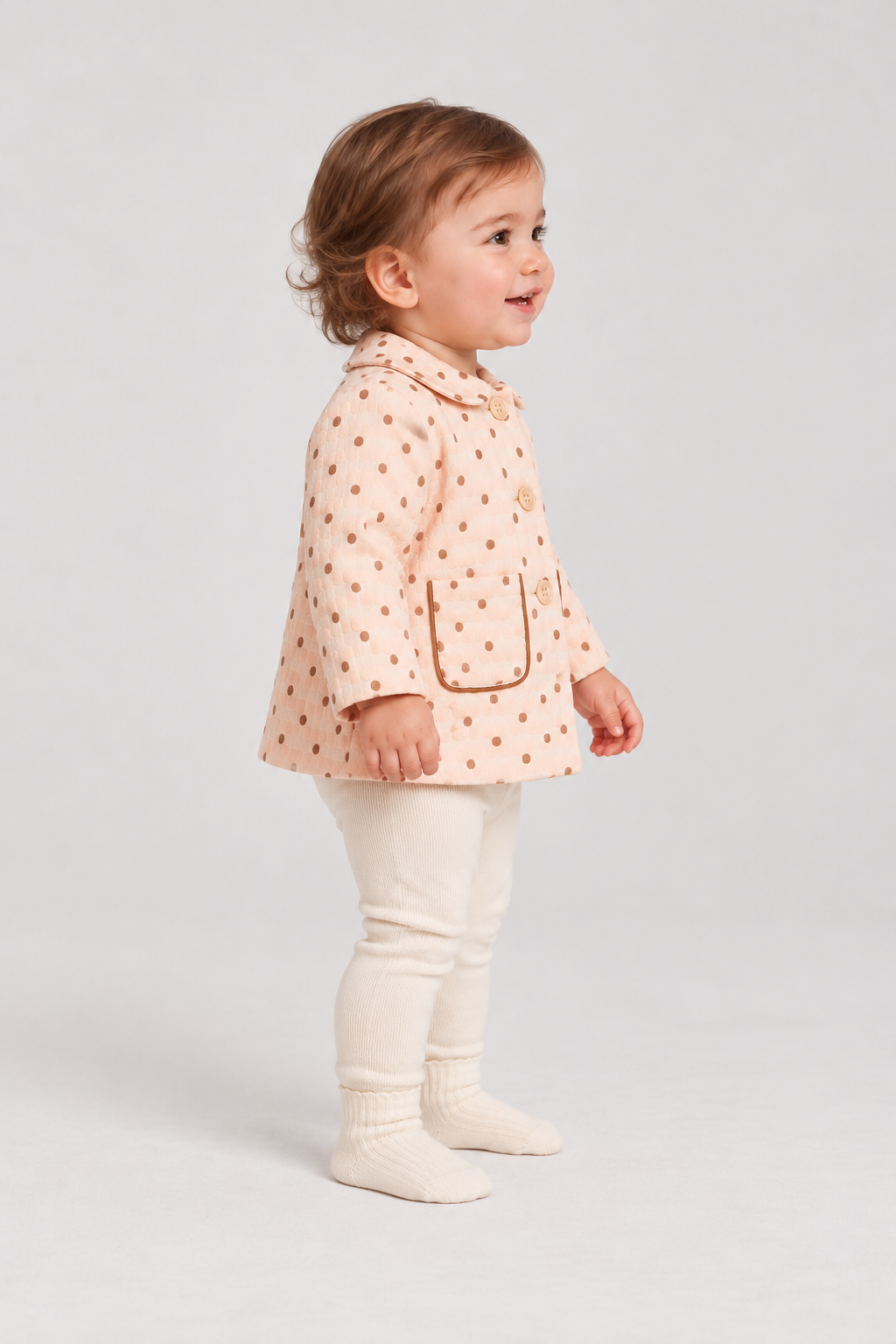 Right side baby girl model view of Gingersnaps dotted jacket
