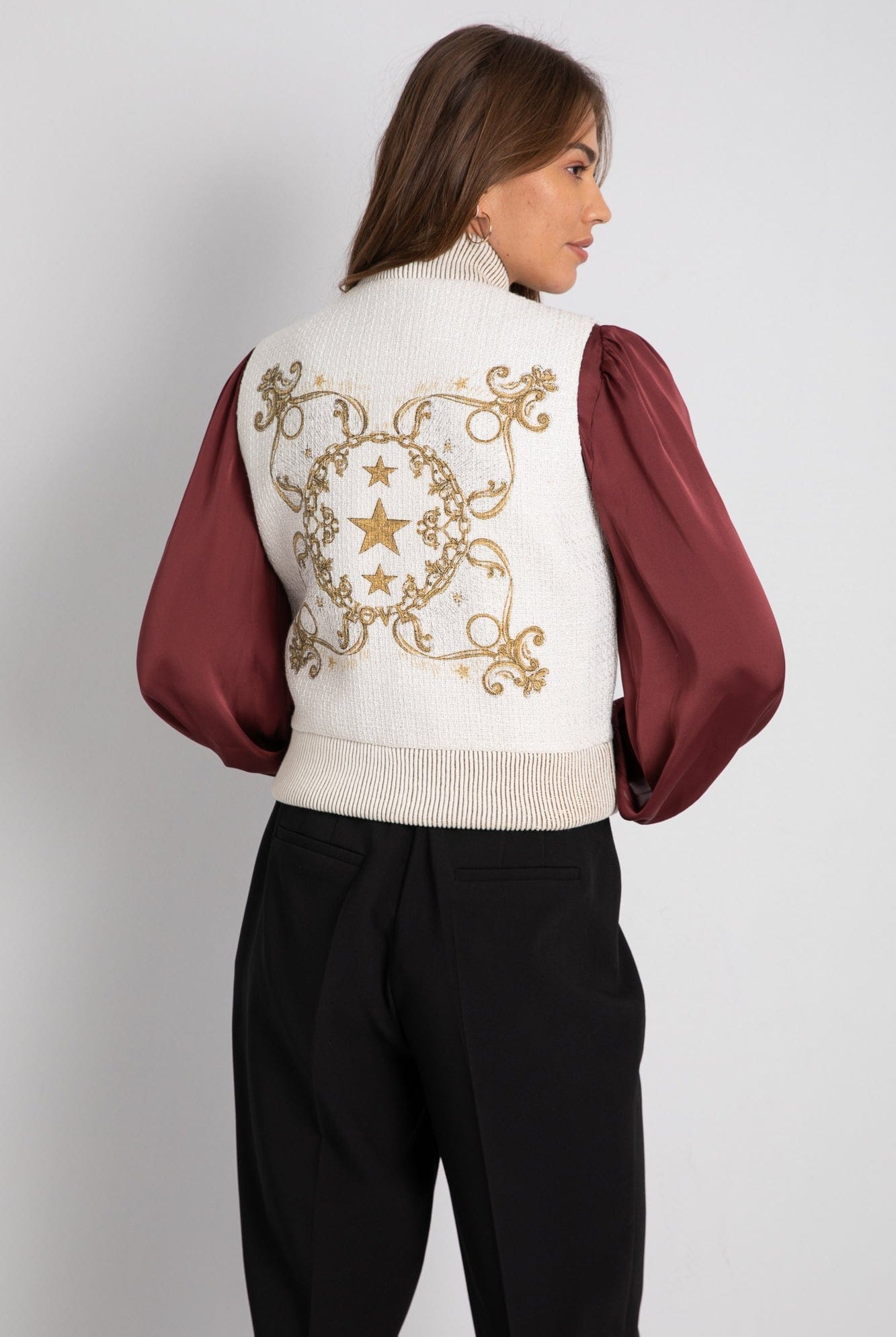 داليدرس جاكيت بلا أكمام بسحاب ذهبي أبيض