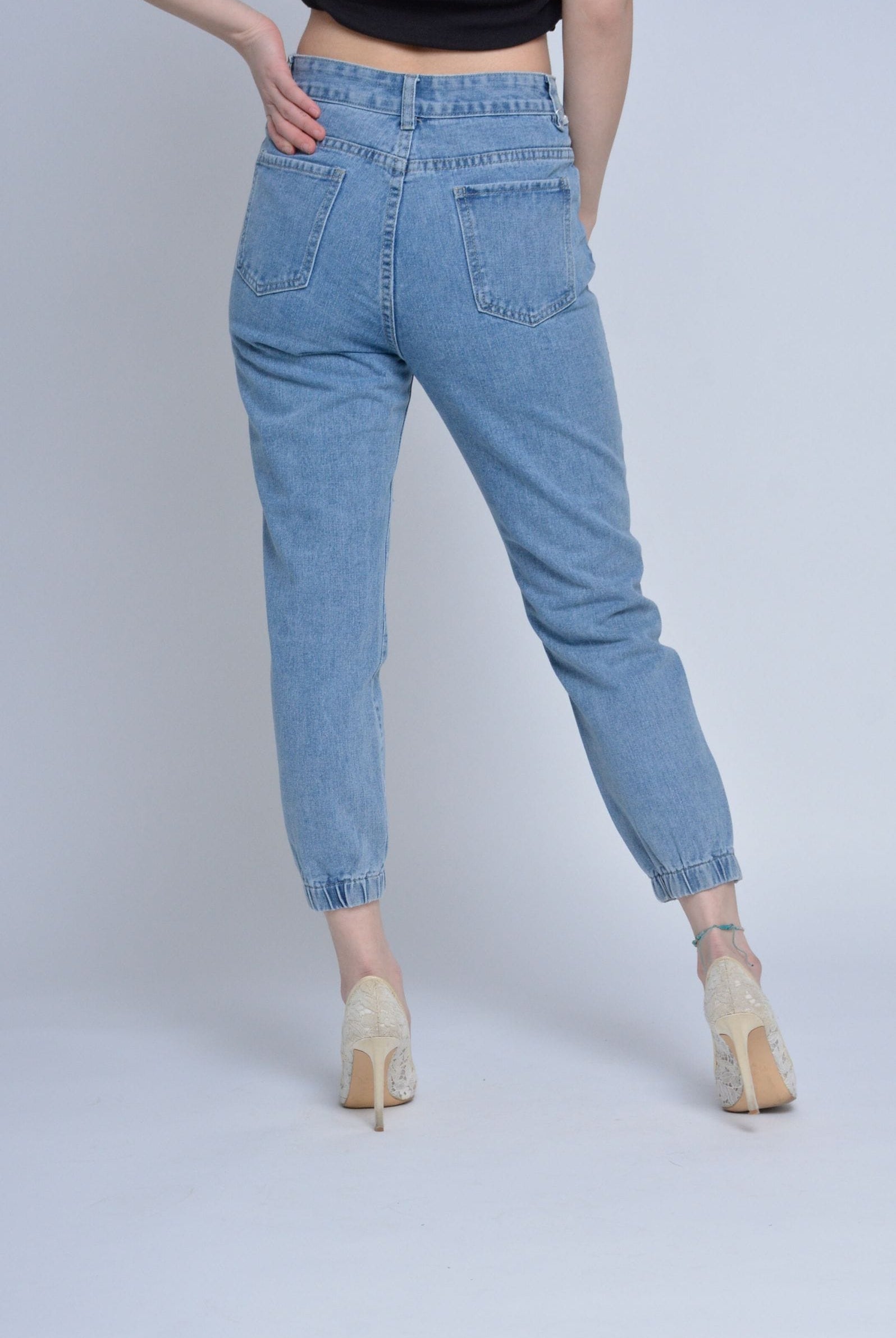 ميكا بنطلون جينز مقطع من الأمام بأساور نسائي