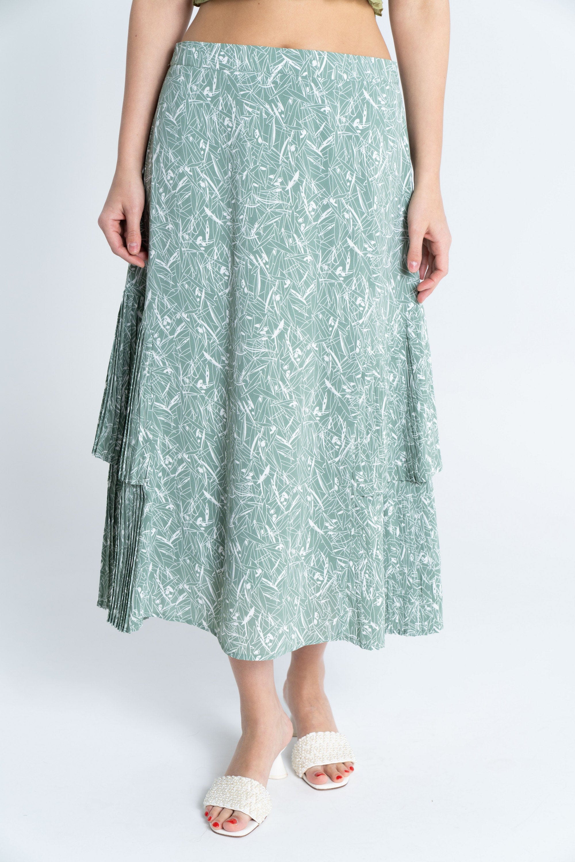 ميكا تنورة ميدي مشجرة بليسية من الأسفل