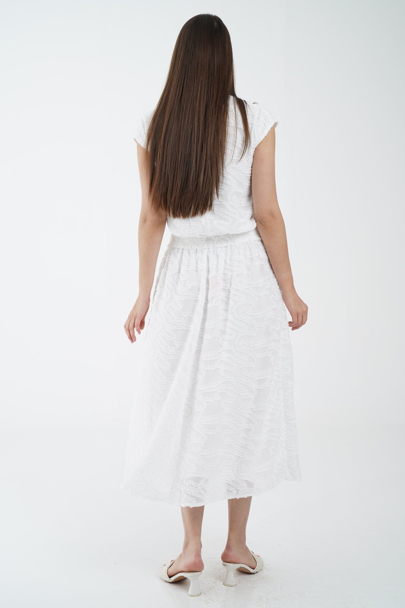 نتشي بلوزة بدون أكمام منقوش بياقة دائرية