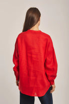 داليدرس بلوزة سادة بأزرار أمامية كم طويل