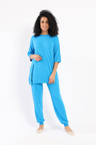 كارينا بلوزة واسعة بفتحة من الجانب كم طويل