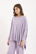 كارينا بلوزة سادة أوفر سايز غير متساوية من أسفل كم طويل