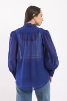 كارينا بلوزة سادة شفافة بربطة عنق كم طويل