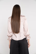 نتشي بلوزة سادة كم طويل بأساور على شكل وردة