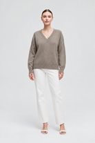 IYE815W264CDY tan long-sleeve V-neck knit sweater on Nina, full front
