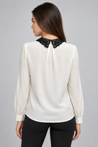 LIV0225AGI beige blouse back on model Liza