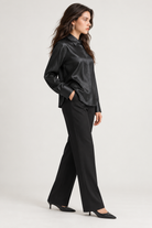 LV1012S263AN black satin blouse on model, side view
