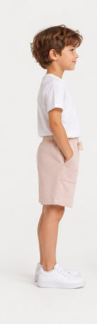 Left side view of Gingersnaps boys blush pink printed shorts