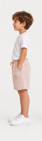 Right side view of Gingersnaps boys blush pink printed shorts
