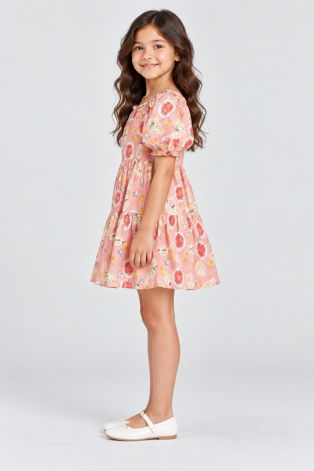 Girls’ blush-pink fruit-print tiered dress, side view on Lina