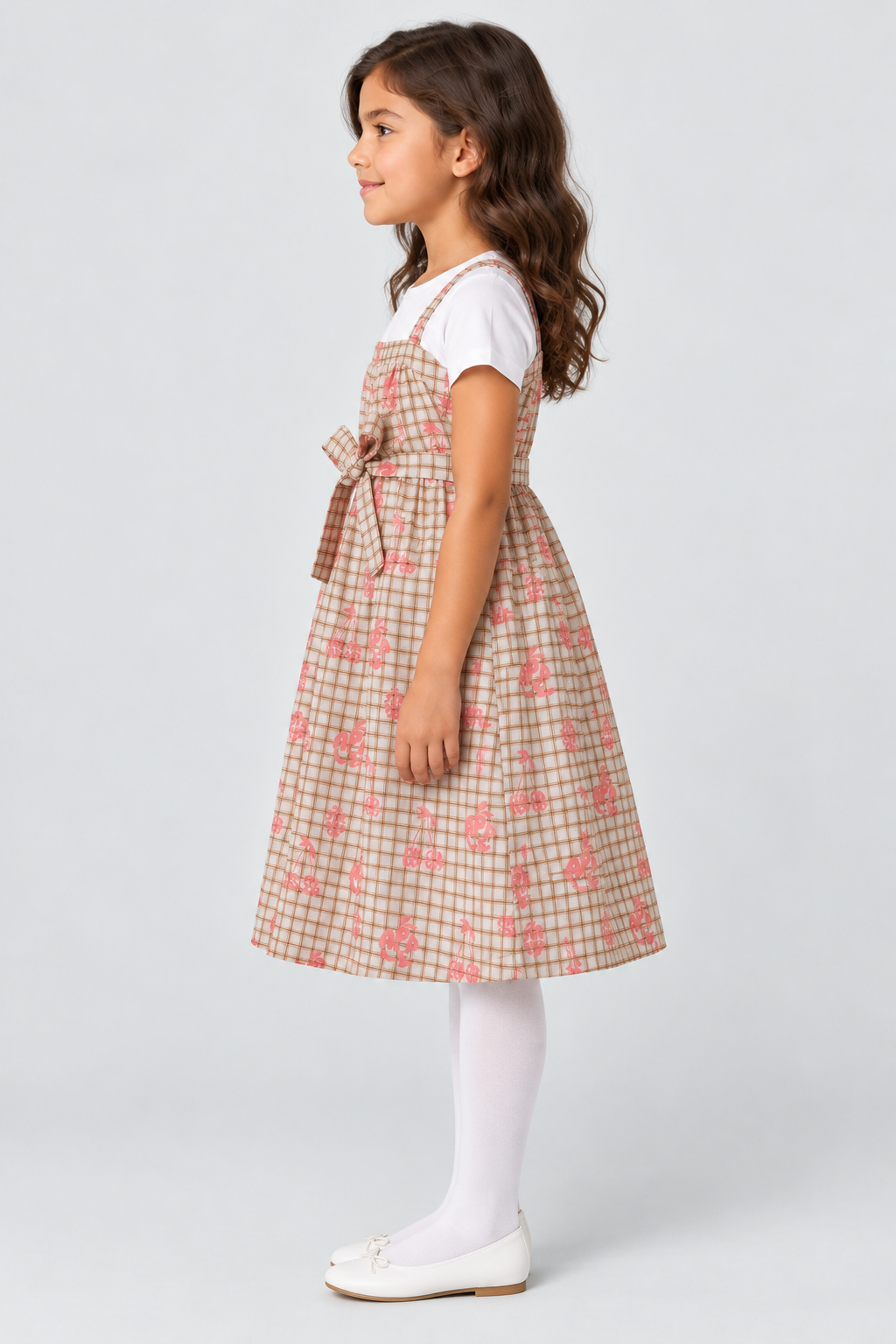 Girls plaid fruit print dress on child model, side view