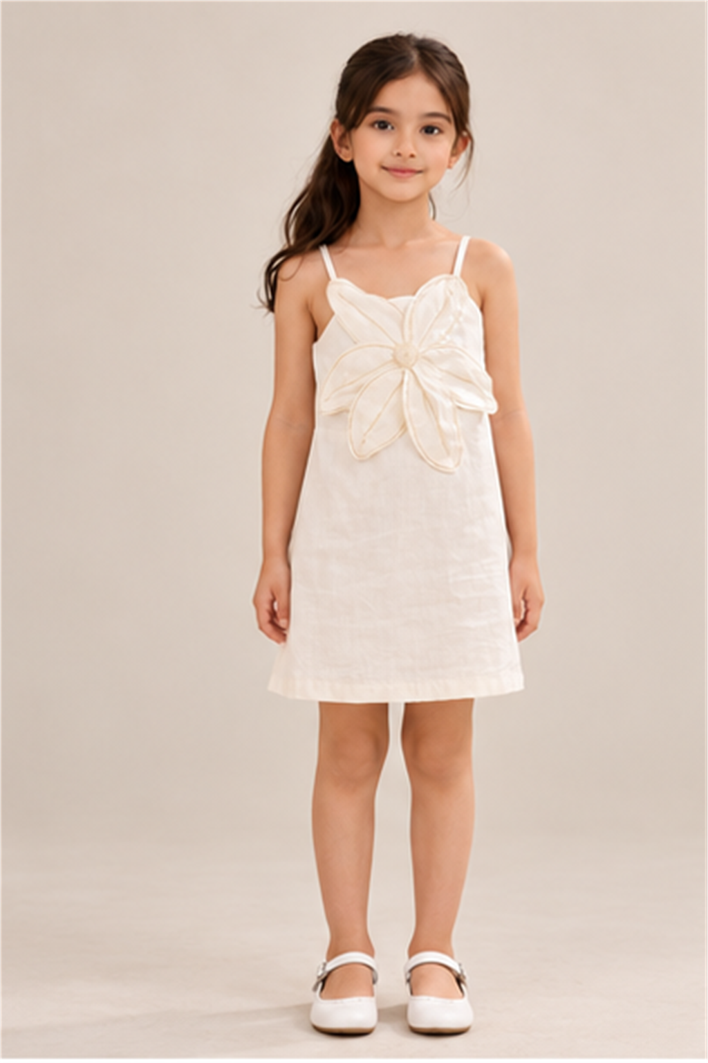 Girls' ivory flower-applique dress on child model, front view