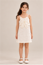 Girls' ivory flower-applique dress on child model, front view