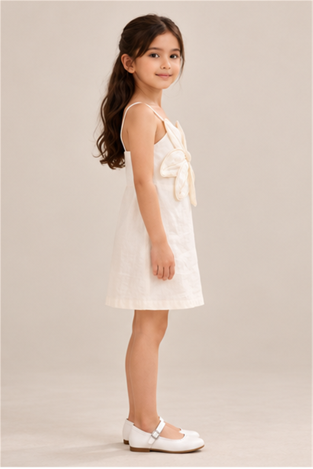 Girls' ivory flower-applique dress on child model, right side view