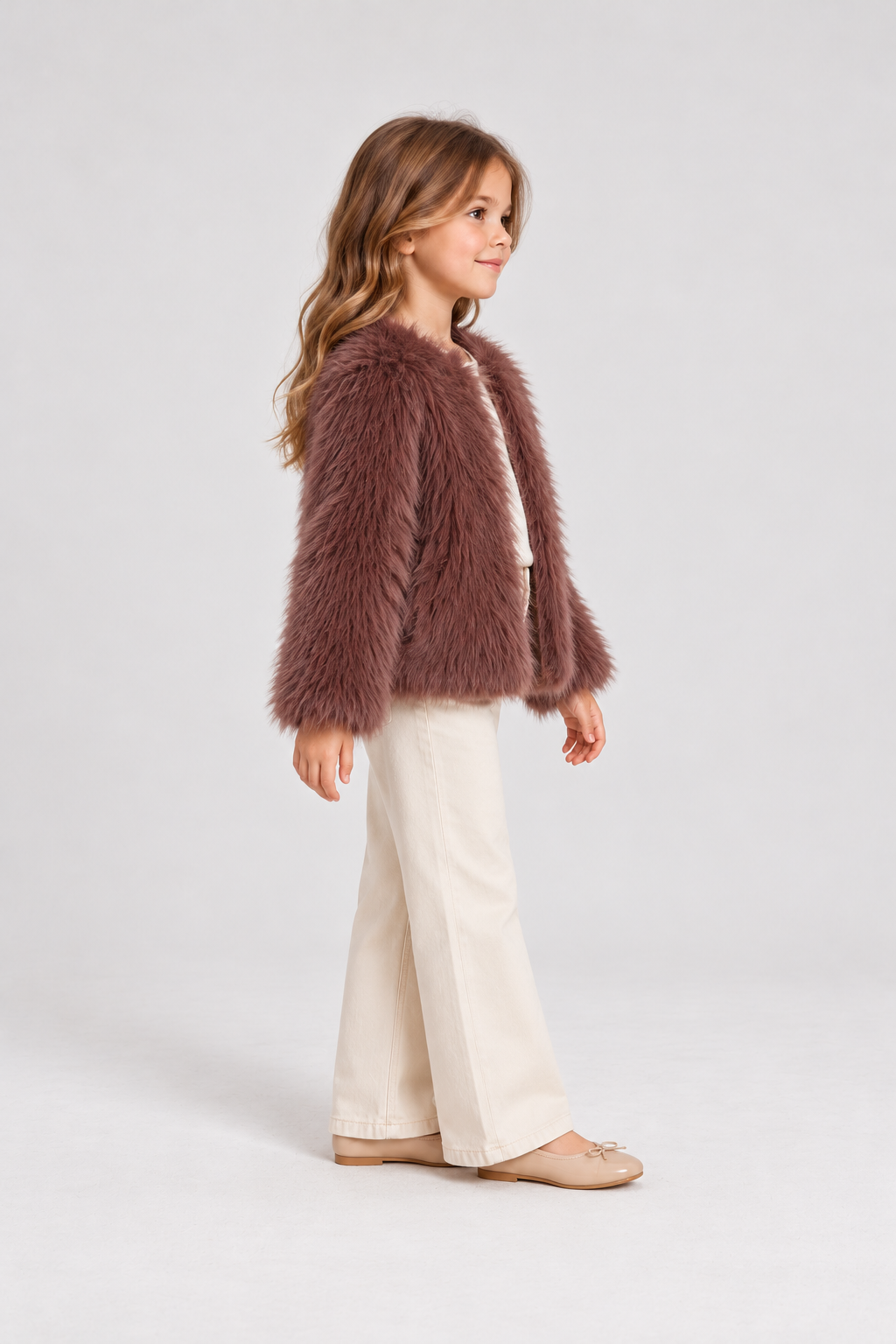Gingersnaps dusty mauve faux fur jacket on child model, left side view