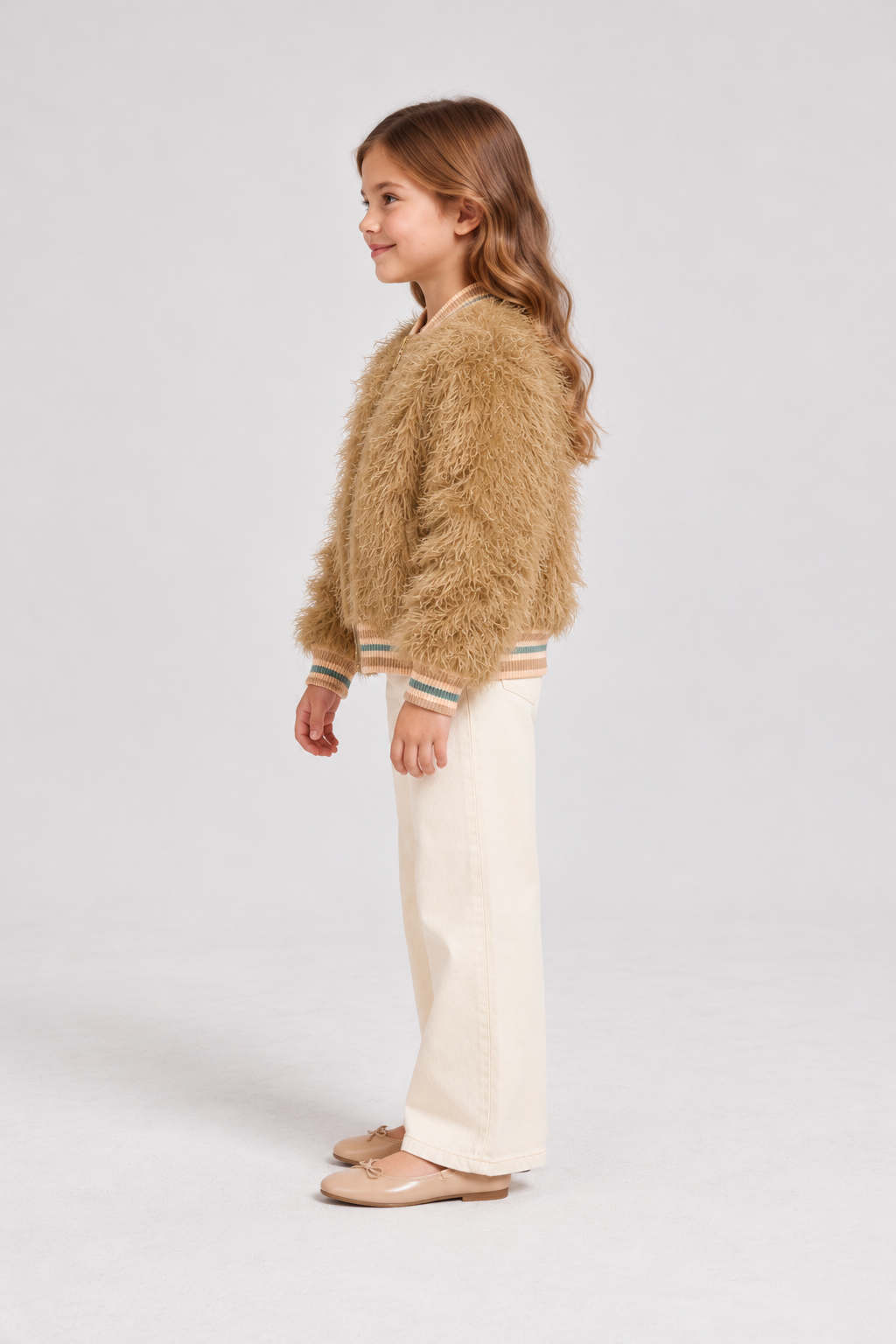 Gingersnaps fuzzy zip jacket on child model, left side view