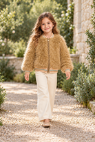 Gingersnaps fuzzy zip jacket on child model, garden lifestyle view