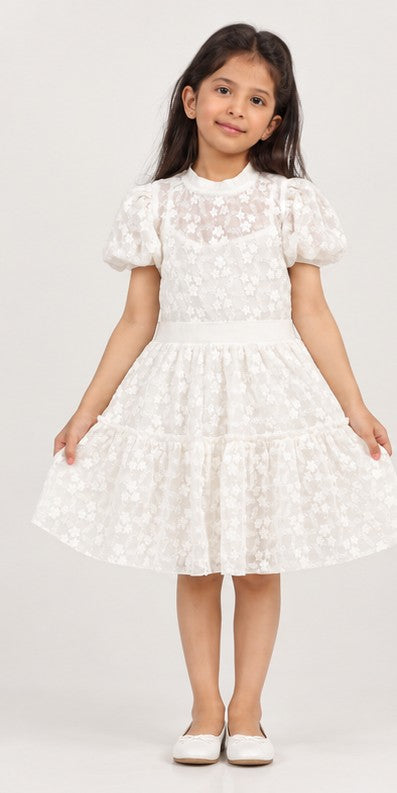 Girl model front view wearing Gingersnaps white embroidered tiered dress