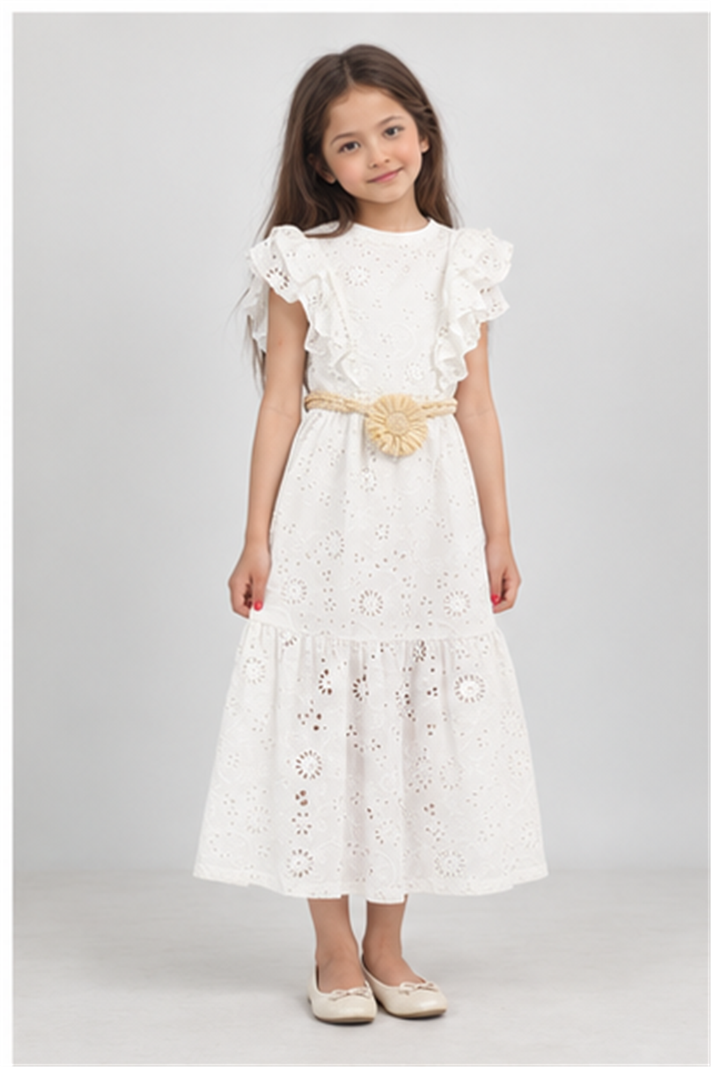 Girls' long white eyelet dress with rosette belt on child model, front view